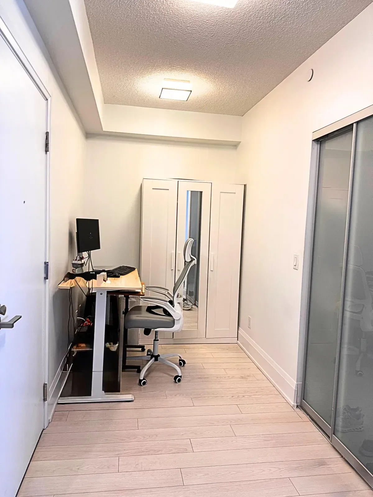 Dedicated den space at 120 Harrison Garden Blvd, perfect for a professional home office setup.