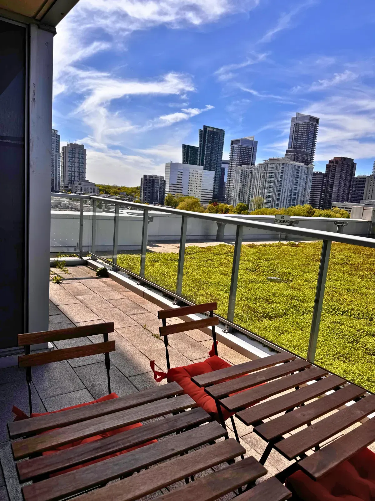 Outdoor living and dining space at Aristo at Avonshire, overlooking the building's LEED® Gold certified green roof.