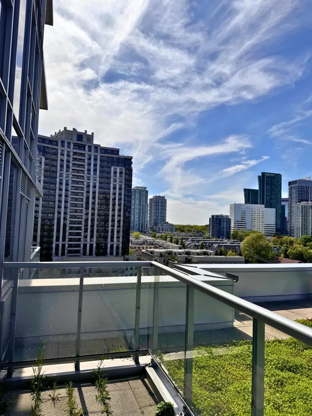 Breathtaking panoramic view of the North York skyline and Highway 401 corridor from a high-floor balcony.