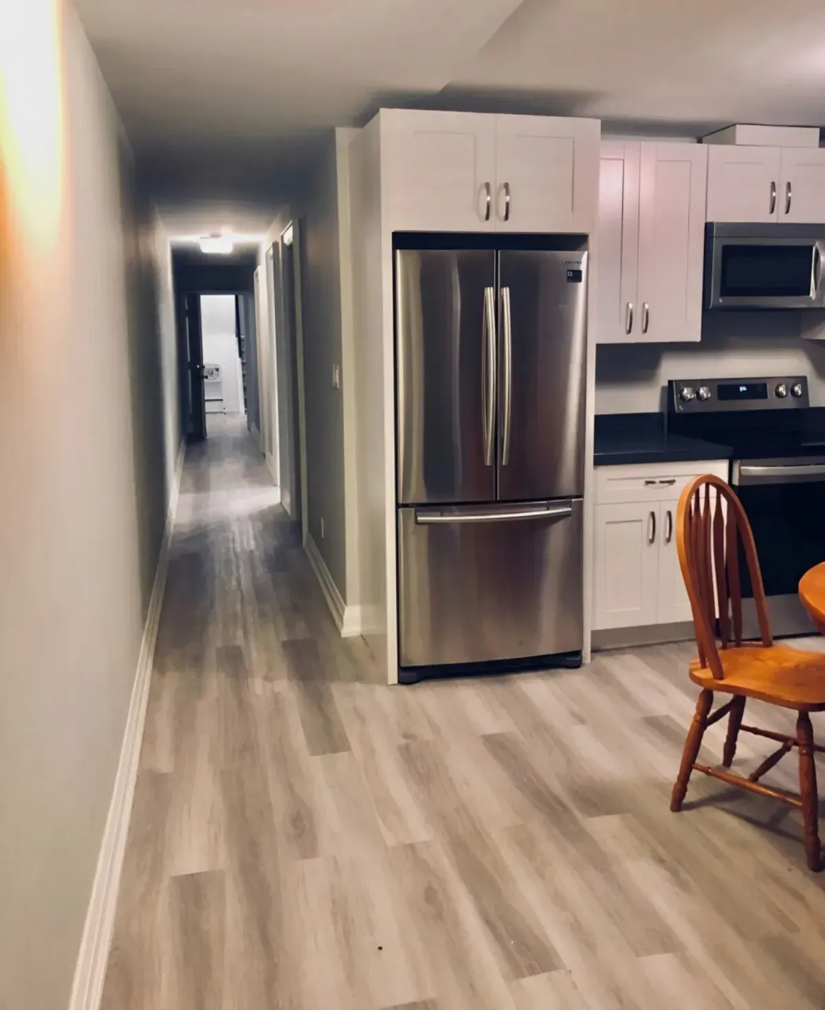 Gourmet kitchen with a dedicated pantry, built-in dishwasher, and elegant finishes in a newly renovated Toronto rental.