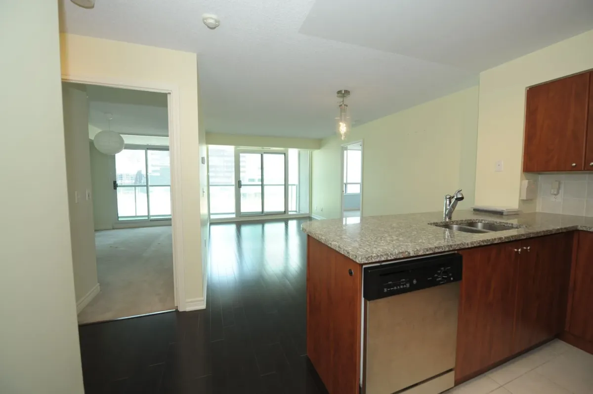 Chef kitchen with granite countertops and stainless steel appliances at 30 Grand Trunk Crescent Unit 509 Toronto.