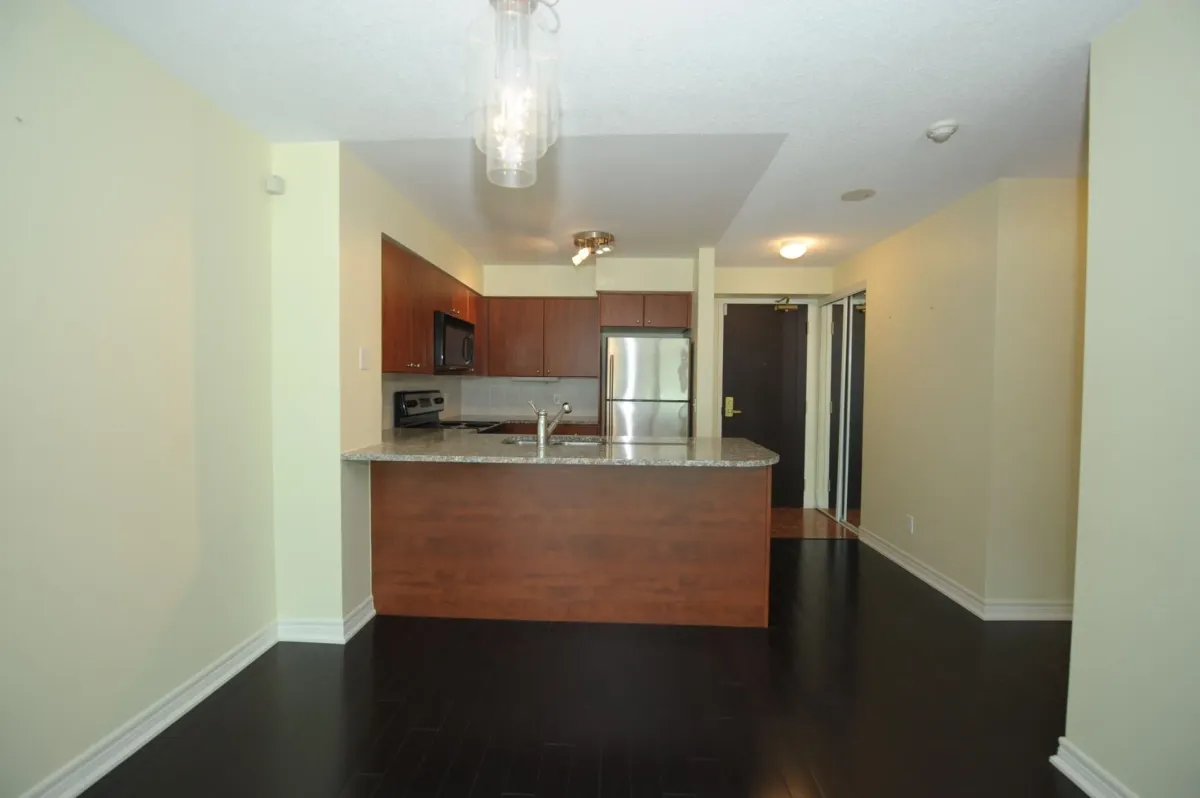 Chef kitchen with granite countertops and stainless steel appliances at 30 Grand Trunk Crescent Unit 509 Toronto.
