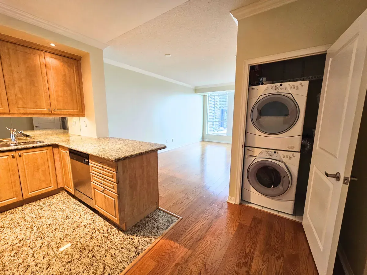 Convenient stacked front-loading washer and dryer located in unit 1311 at 628 Fleet St.