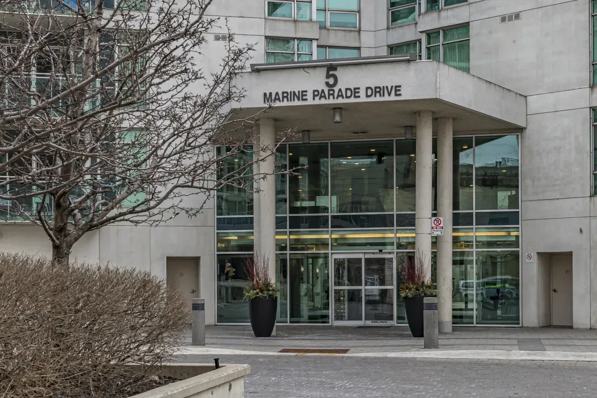 The grand, glass-canopied main entrance to the luxury residences at 5 Marine Parade Dr #630, Etobicoke.