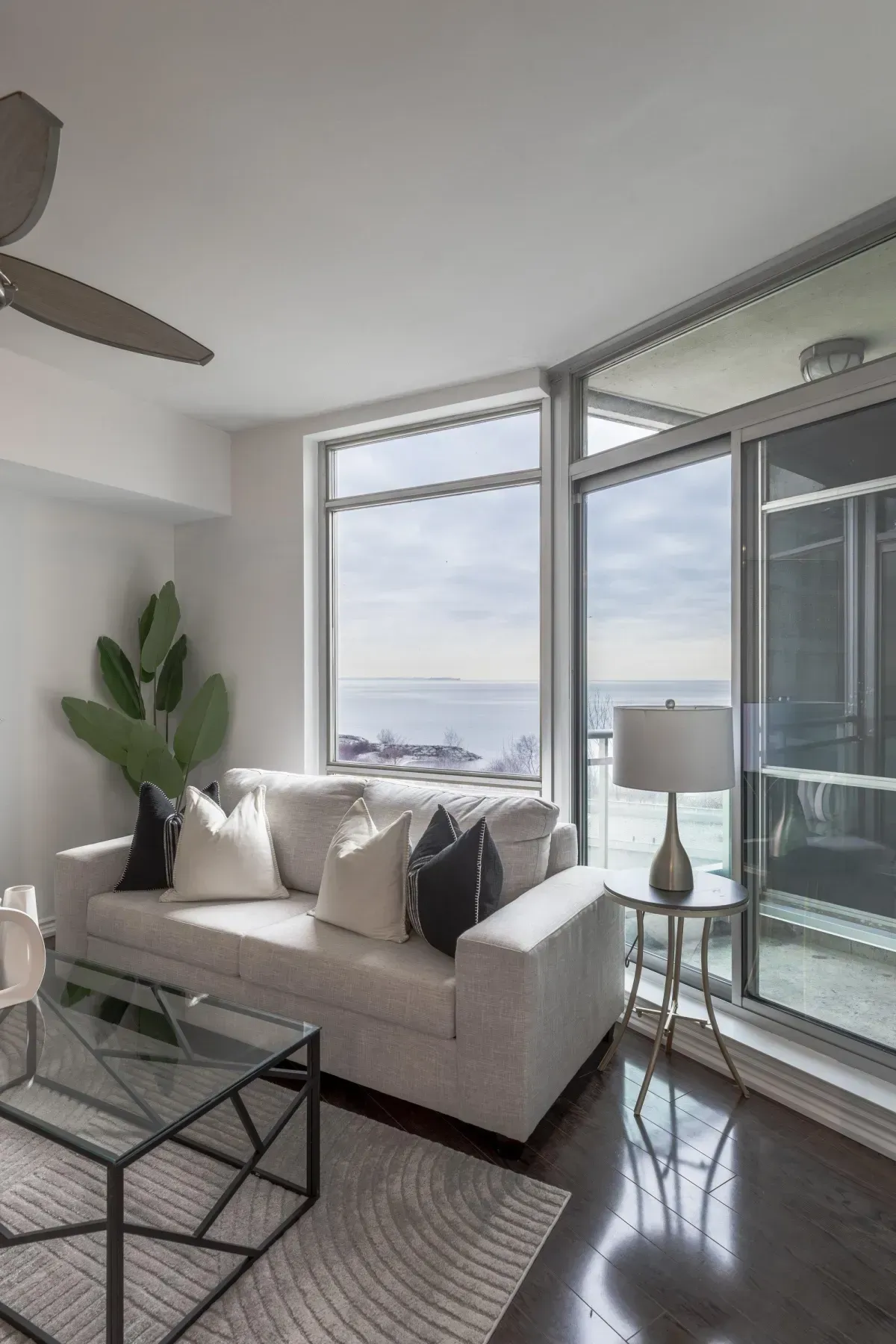 Southwest-facing floor-to-ceiling windows at 5 Marine Parade Dr #630, Etobicoke, showcasing expansive views of Lake Ontario.