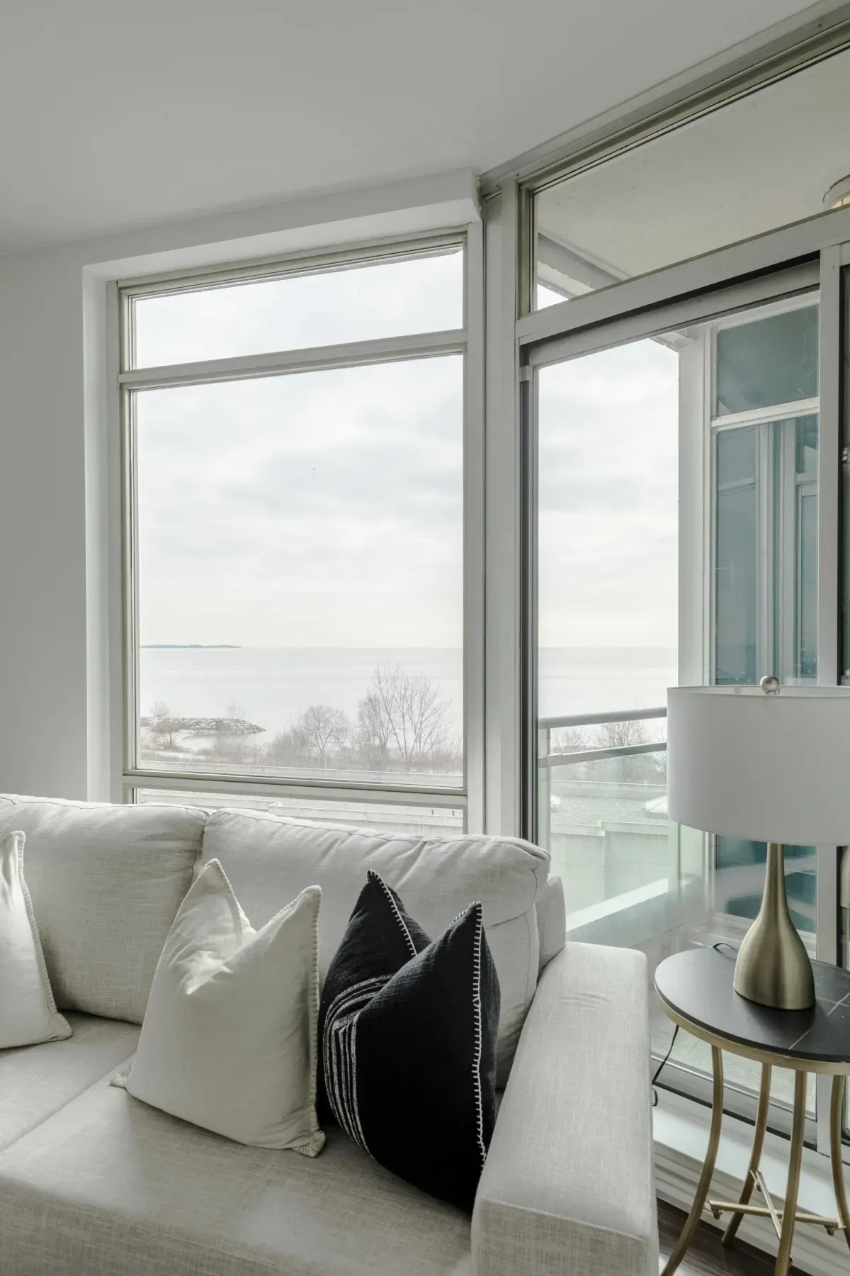 Southwest-facing floor-to-ceiling windows at 5 Marine Parade Dr #630, Etobicoke, showcasing expansive views of Lake Ontario.