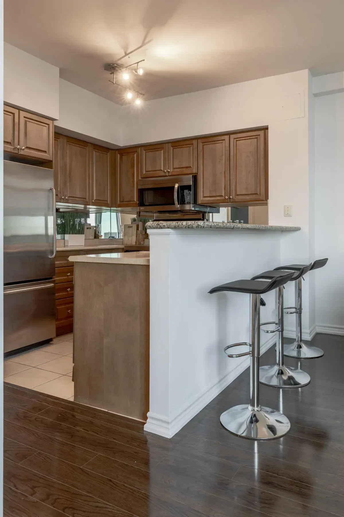 Raised breakfast bar with seating at 5 Marine Parade Dr #630, Etobicoke, ideal for casual morning coffee.