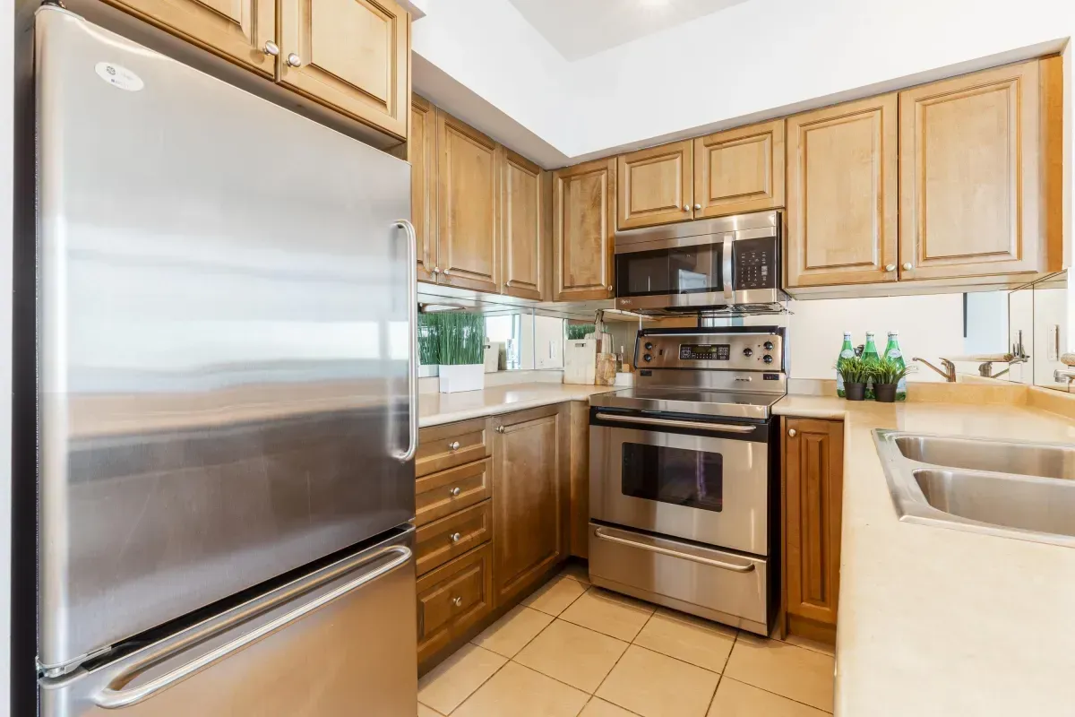 Close-up of the built-in microwave and stainless steel range at 5 Marine Parade Dr #630, Etobicoke.