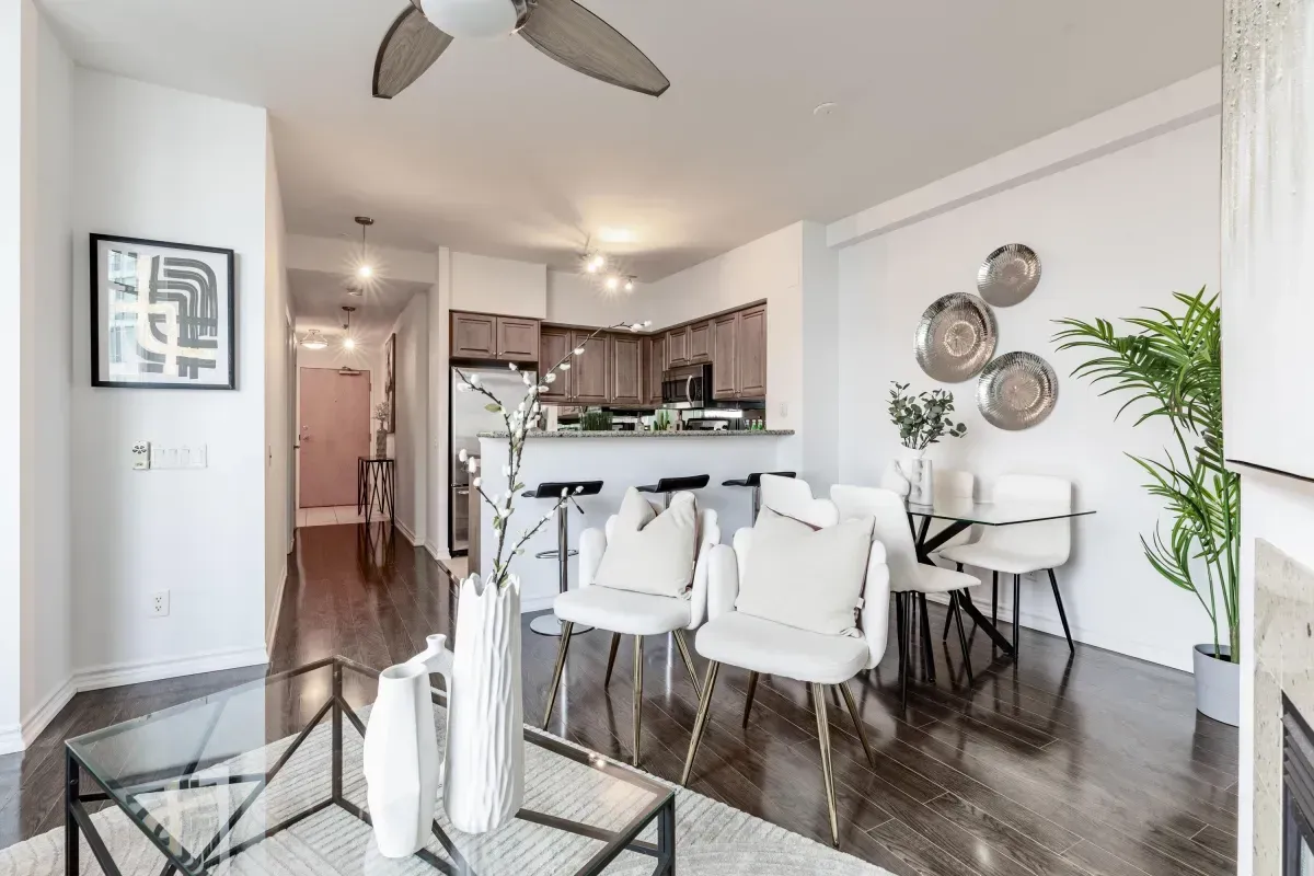 A full view of the seamless layout between the kitchen, dining, and living areas at 5 Marine Parade Dr #630, Etobicoke.