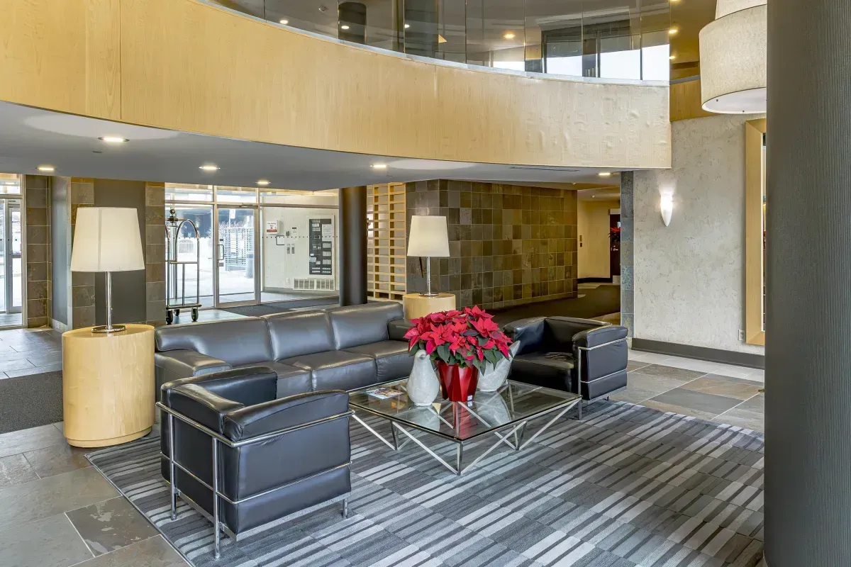 Sophisticated building lobby with designer seating and high ceilings at 5 Marine Parade Dr #630, Etobicoke.
