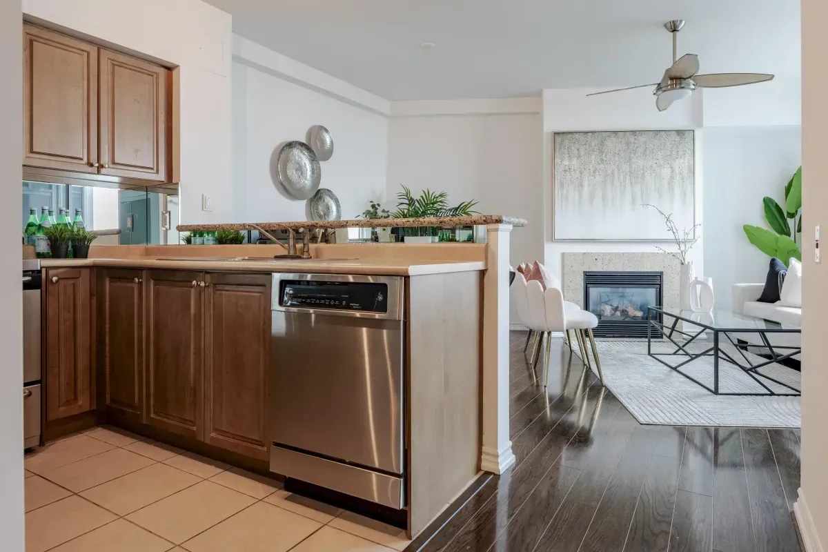 Modern kitchen at 5 Marine Parade Dr #630, Etobicoke, with stainless steel appliances, ample cabinetry, and tile flooring.