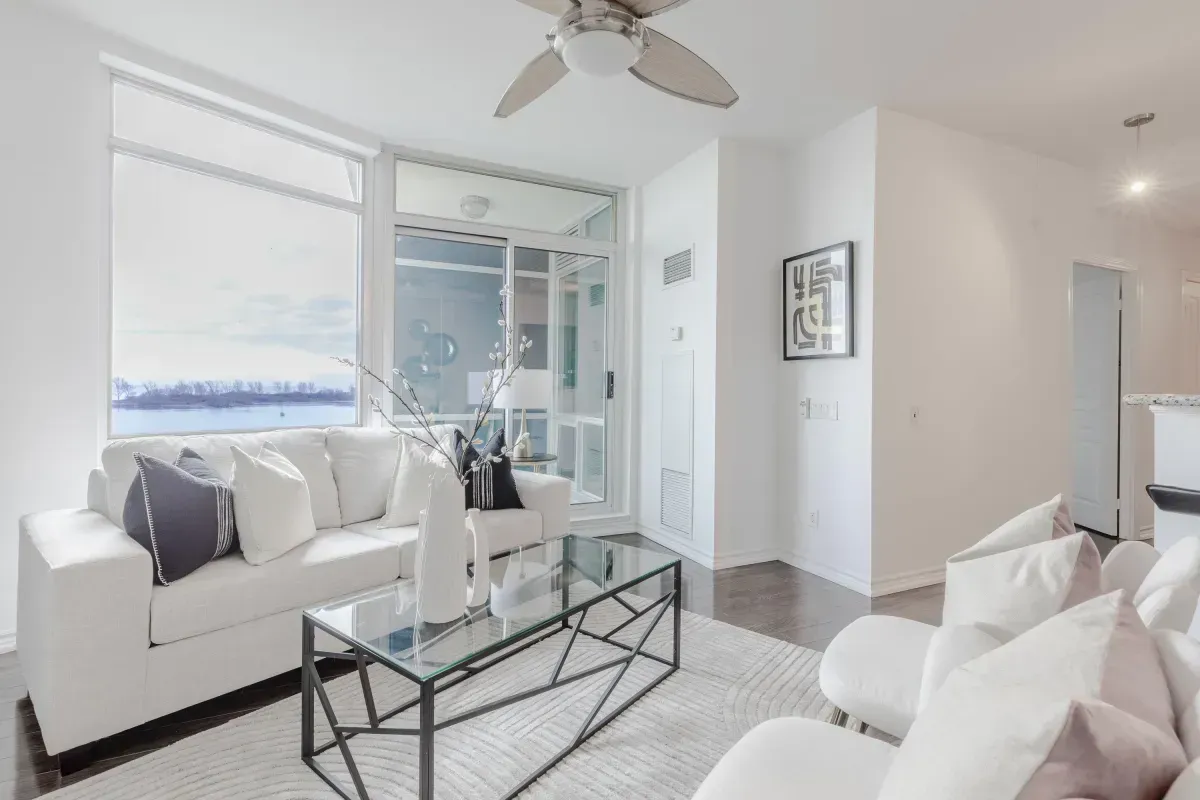 Southwest-facing floor-to-ceiling windows at 5 Marine Parade Dr #630, Etobicoke, showcasing expansive views of Lake Ontario.