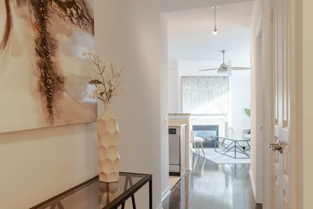 Elegant hallway at 5 Marine Parade Dr #630, Etobicoke, leading into the bright, open-concept living area.
