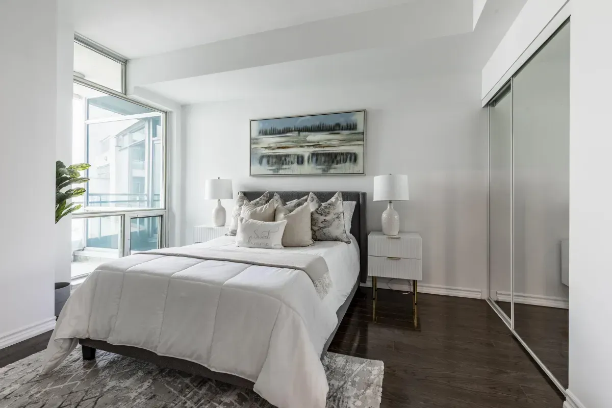Large windows offering plenty of natural light in the bedroom at 5 Marine Parade Dr #630, Etobicoke.