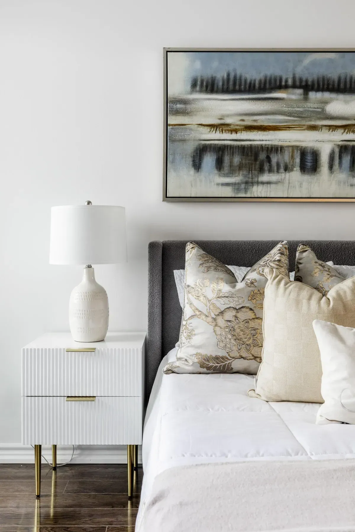 Spacious primary bedroom at 5 Marine Parade Dr #630, Etobicoke, featuring mirrored closets, hardwood floors, and balcony access.