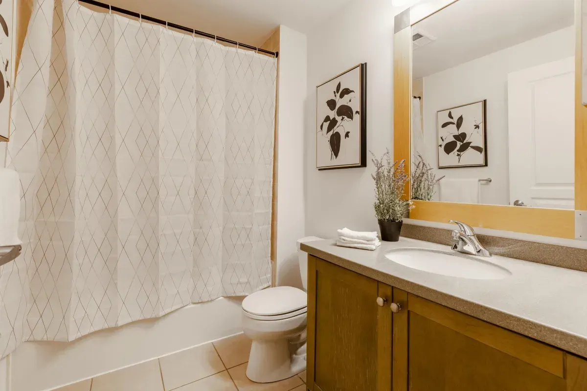 Clean and spacious 4-piece bathroom at 5 Marine Parade Dr #630, Etobicoke, with a large vanity and integrated shower/tub.