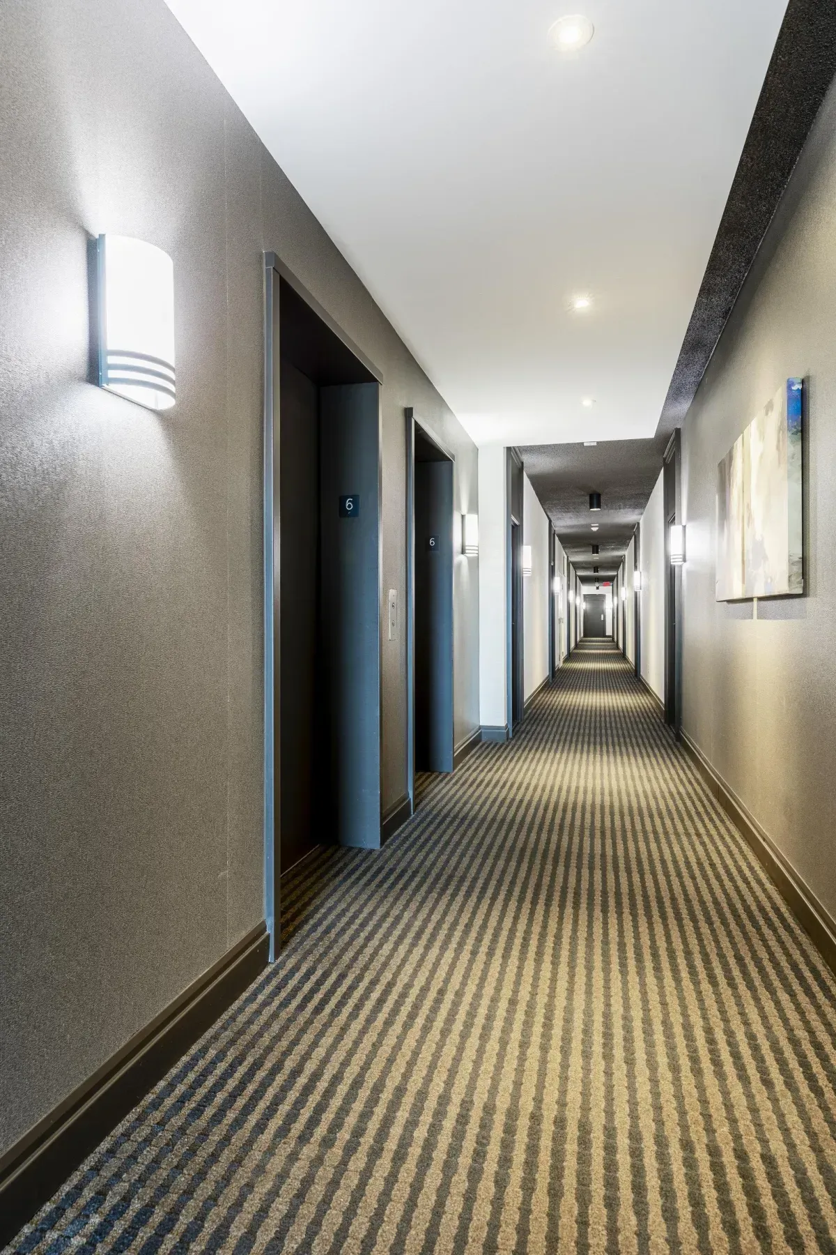 The grand, glass-canopied main entrance to the luxury residences at 5 Marine Parade Dr #630, Etobicoke.