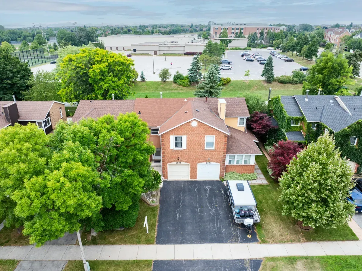 A bird's-eye view of the quiet, tree-lined street and residential pocket surrounding 2286 Margot St, Oakville.