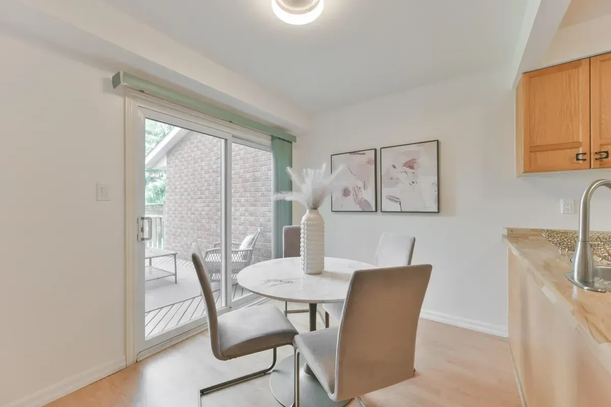 Light-filled casual dining area at 2286 Margot St, Oakville, with sliding glass door access to the private backyard.