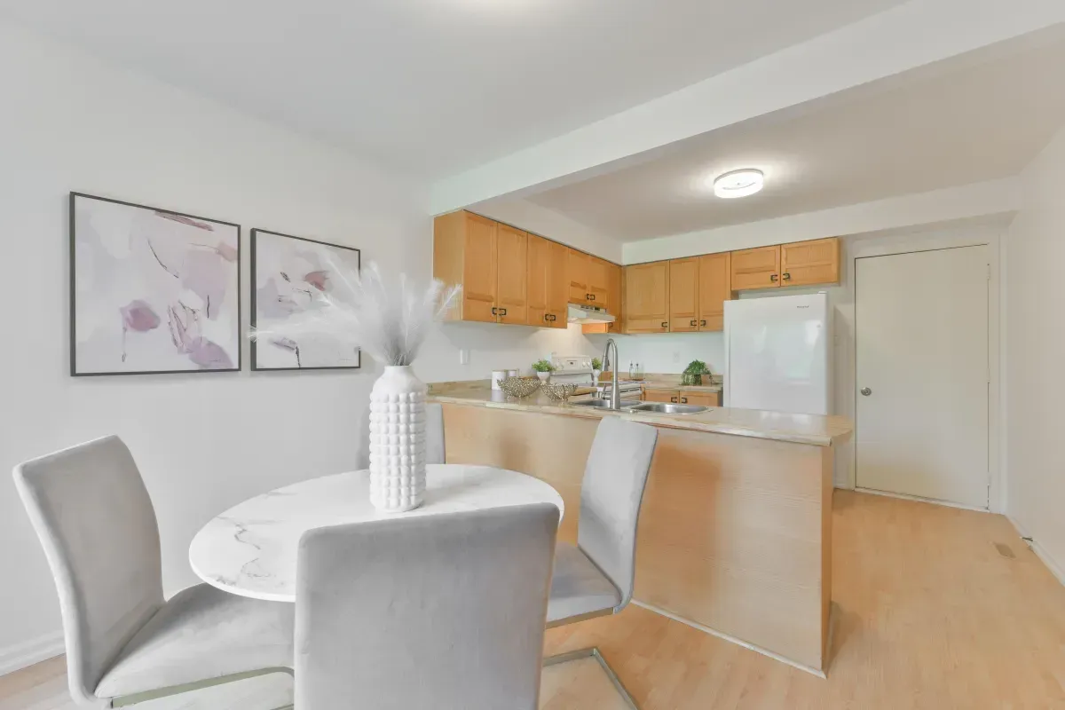 Light-filled casual dining area at 2286 Margot St, Oakville, with sliding glass door access to the private backyard.