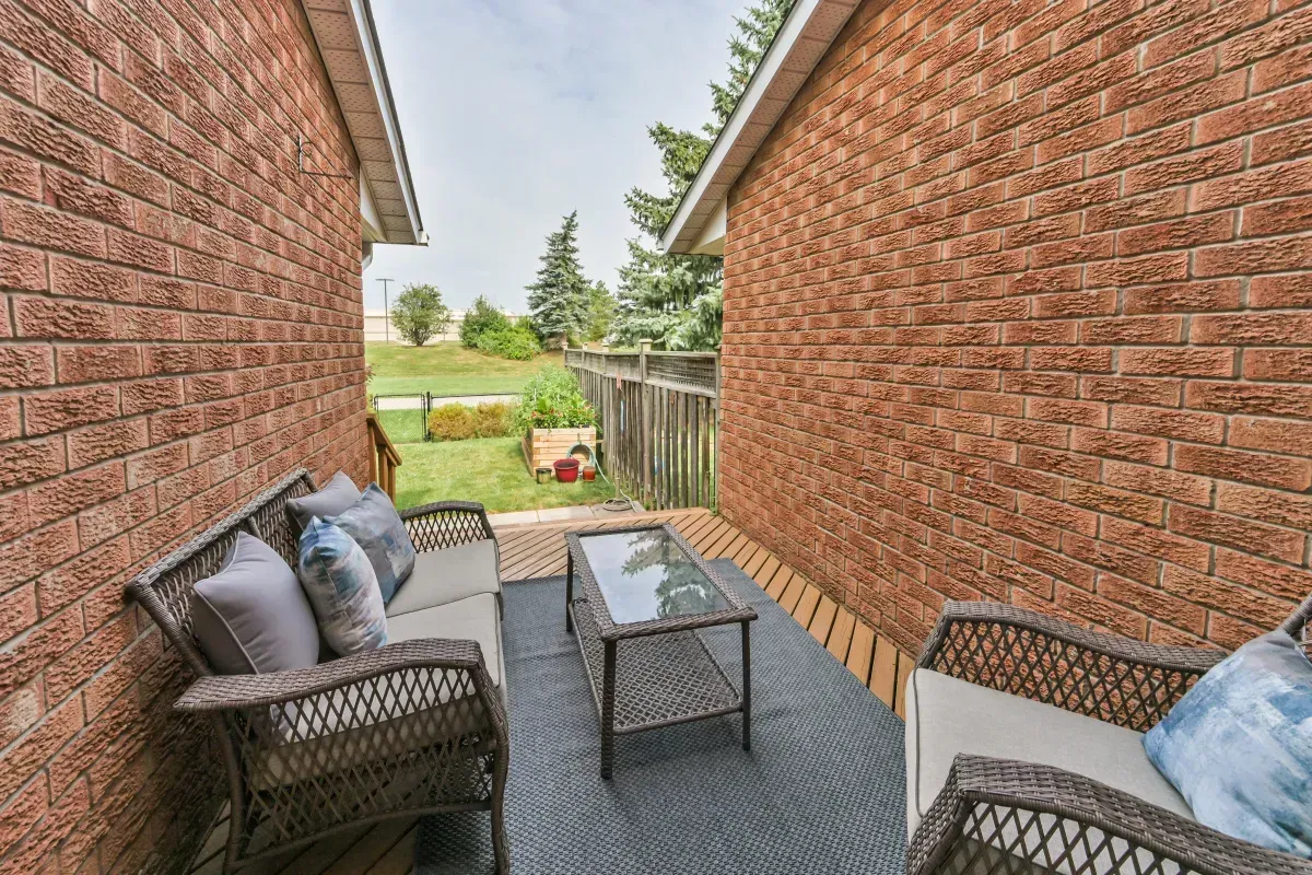 Fully fenced, private backyard sanctuary at 2286 Margot St, Oakville, featuring a patio area for outdoor entertaining.