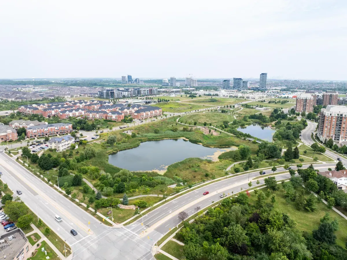 Beautiful aerial view of the neighborhood pond and natural conservation areas near 2286 Margot St, Oakville.