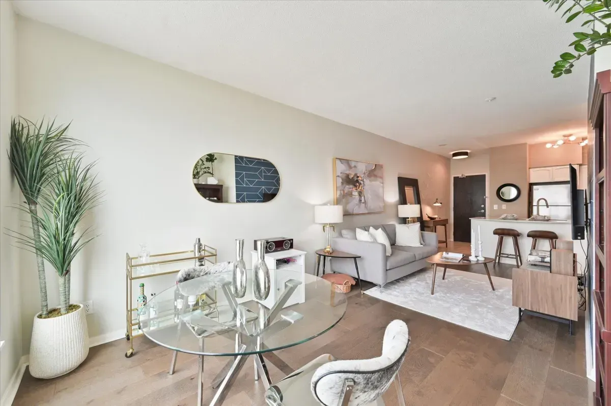 Sun-filled dining space in Toronto 1-bedroom condo featuring floor-to-ceiling windows and lake views.