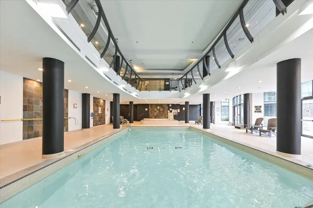 Full-length indoor lap pool at Club Oasis, 219 Fort York Blvd residential amenities.