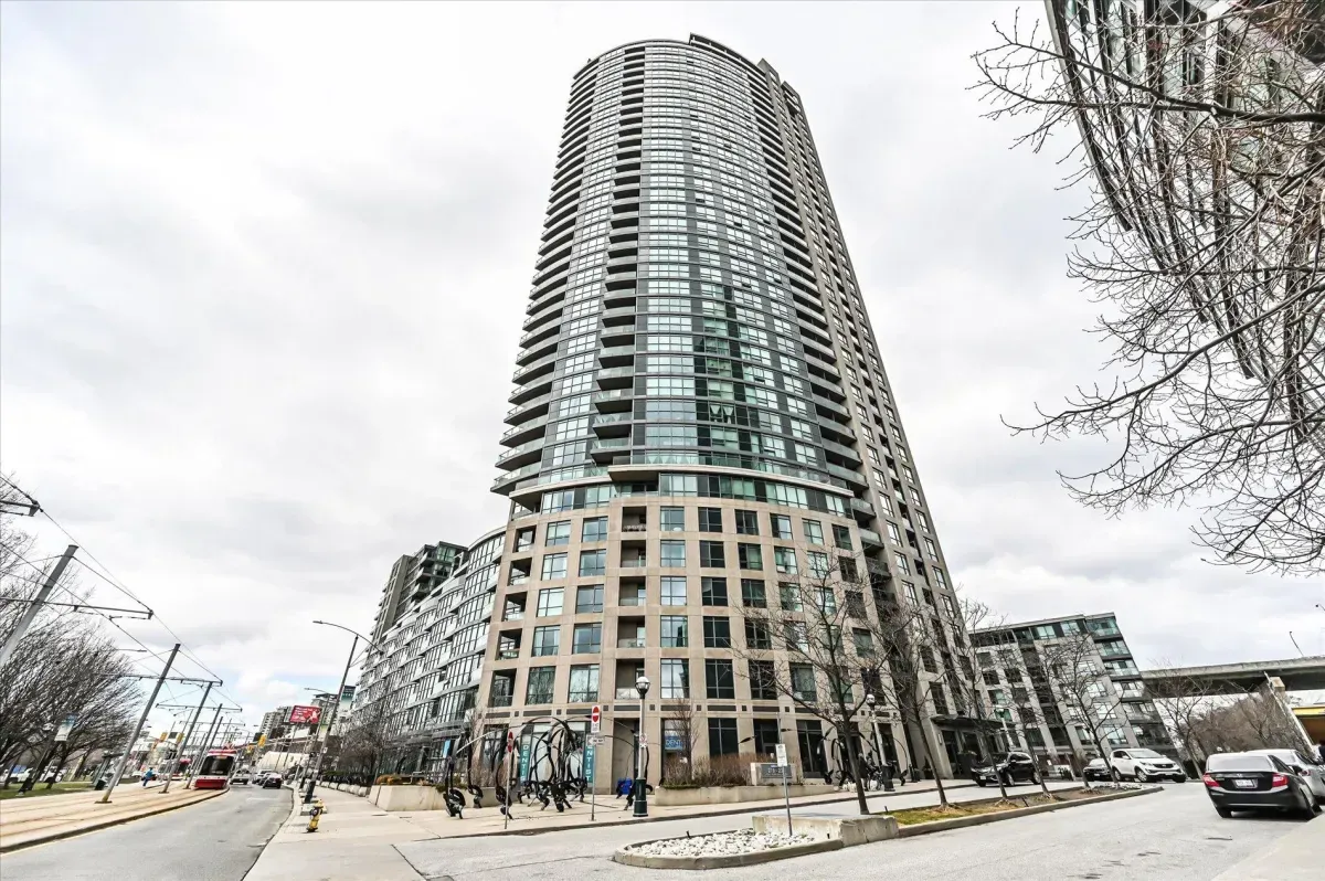 Modern glass high-rise exterior of Aquarius at Waterpark City, 219 Fort York Blvd, Toronto.