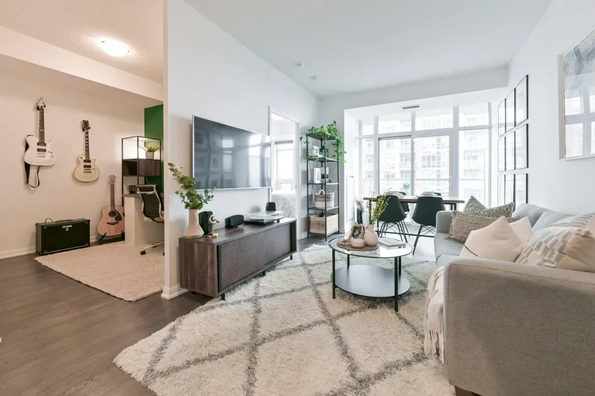 Sun-drenched living room with Southeast exposure and Lake Ontario views at 85 E Liberty St #1909.