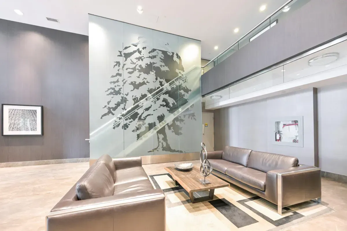 Sophisticated double-height lobby with designer lighting and seating at 85 E Liberty St.