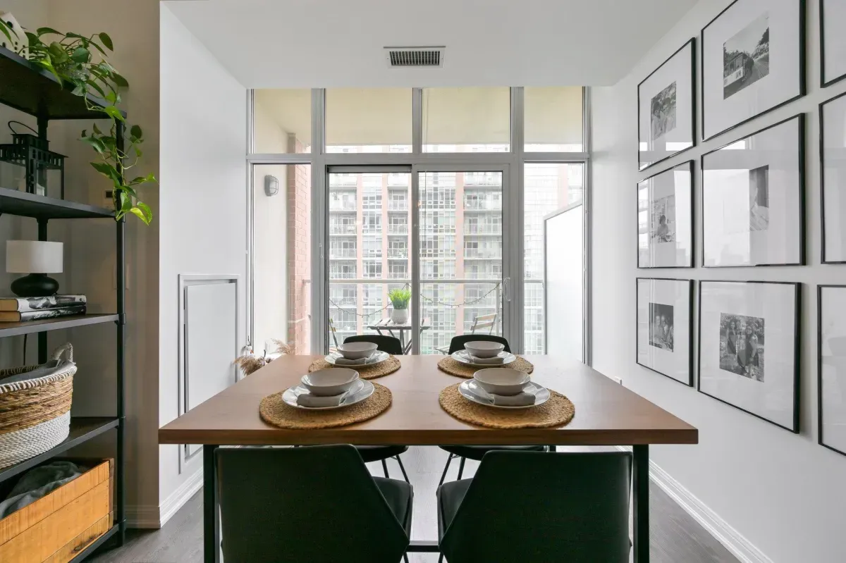 Bright, open-concept dining space with floor-to-ceiling windows in a 1-bedroom Liberty Village condo.
