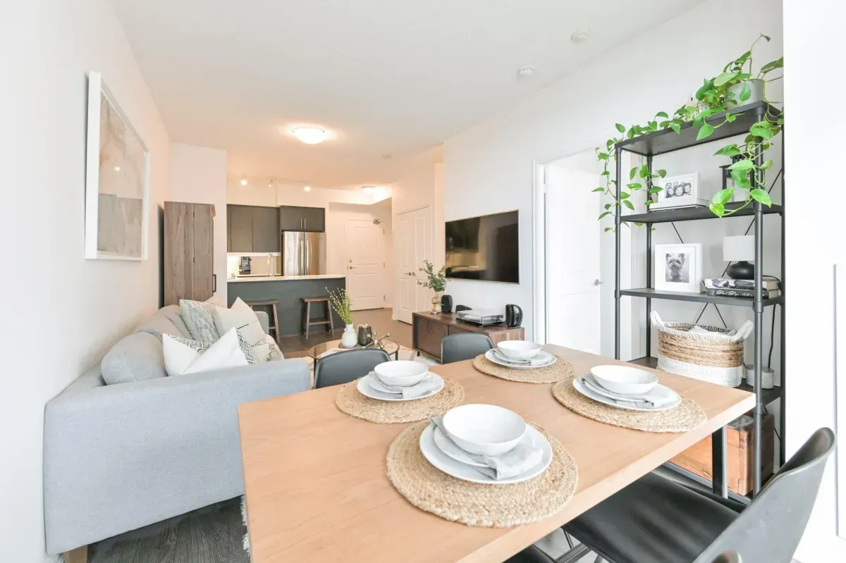 Bright, open-concept dining space with floor-to-ceiling windows in a 1-bedroom Liberty Village condo.