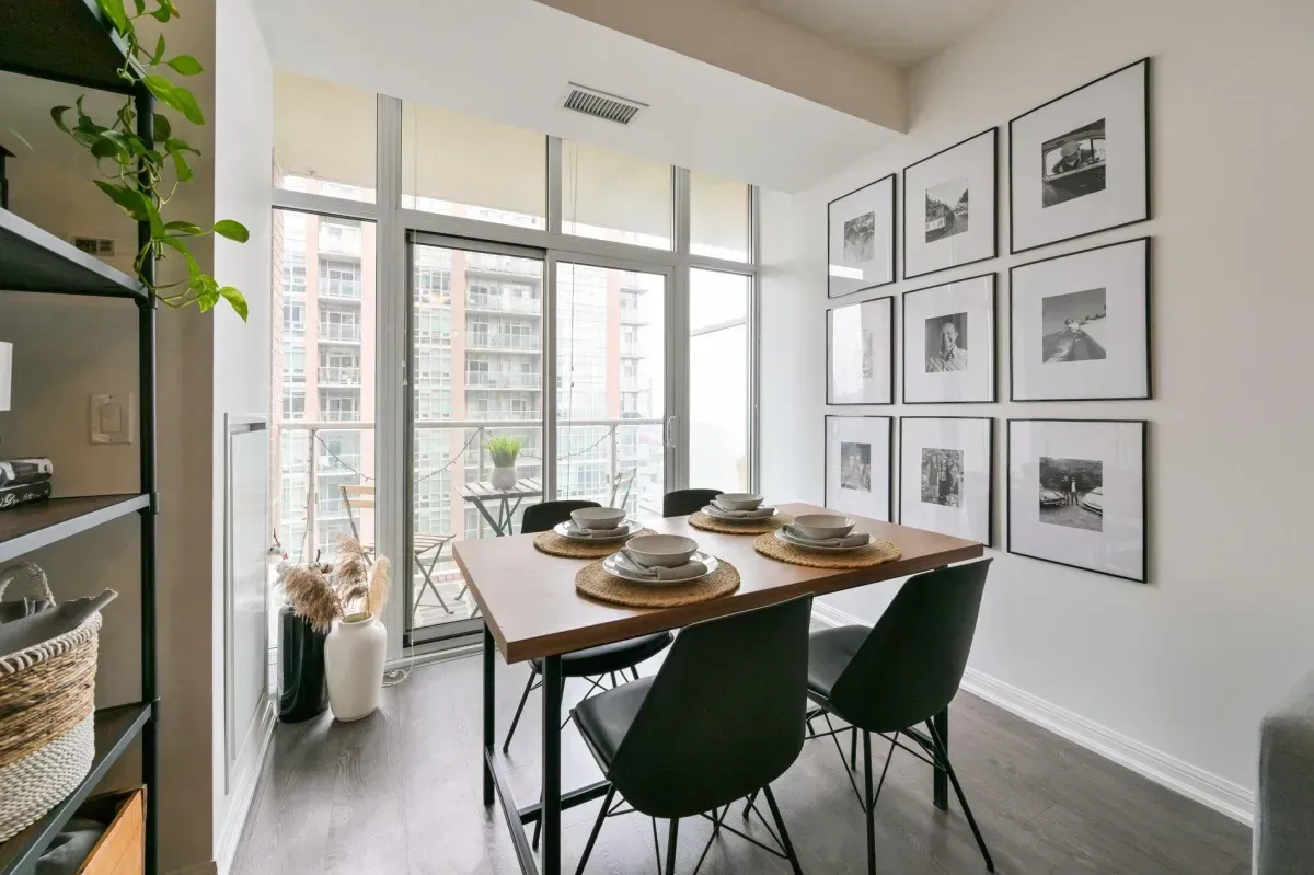 Bright, open-concept dining space with floor-to-ceiling windows in a 1-bedroom Liberty Village condo.