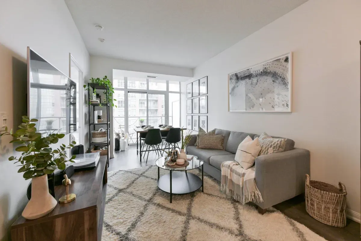 Sun-drenched living room with Southeast exposure and Lake Ontario views at 85 E Liberty St #1909.