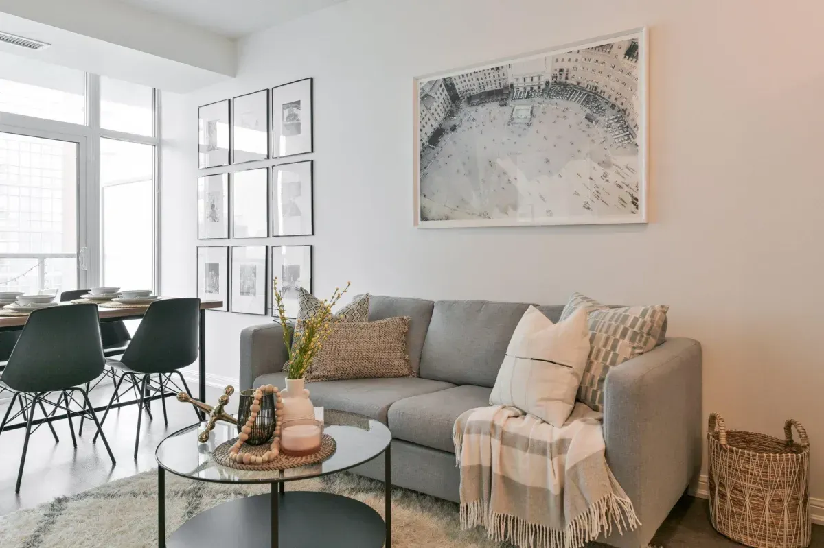 Sun-drenched living room with Southeast exposure and Lake Ontario views at 85 E Liberty St #1909.