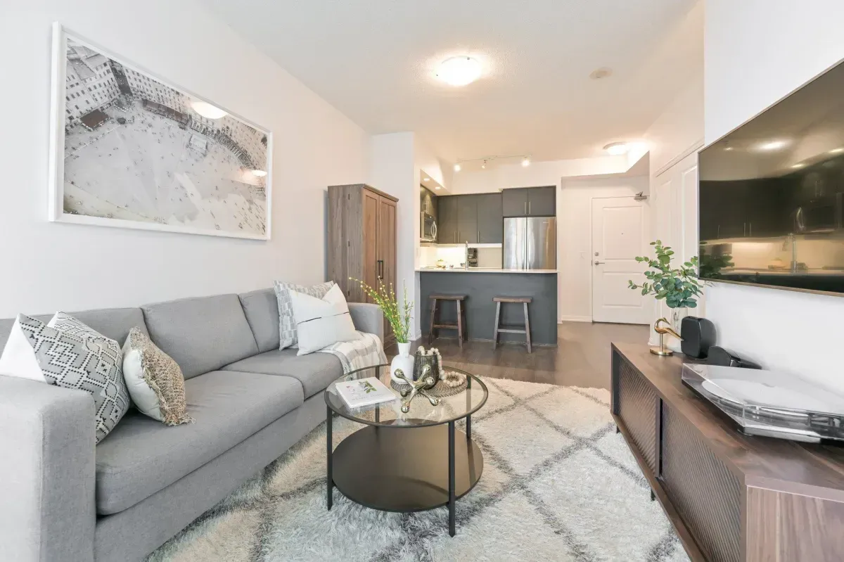 Sun-drenched living room with Southeast exposure and Lake Ontario views at 85 E Liberty St #1909.