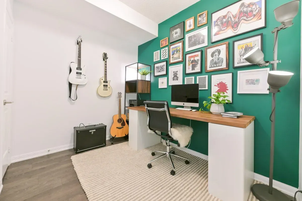 Custom built-in workspace with a vibrant green accent wall, ideal for working from home in Liberty Village.