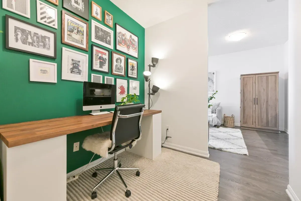 Custom built-in workspace with a vibrant green accent wall, ideal for working from home in Liberty Village.