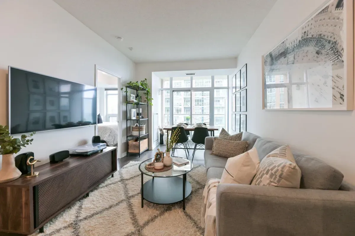 Sun-drenched living room with Southeast exposure and Lake Ontario views at 85 E Liberty St #1909.