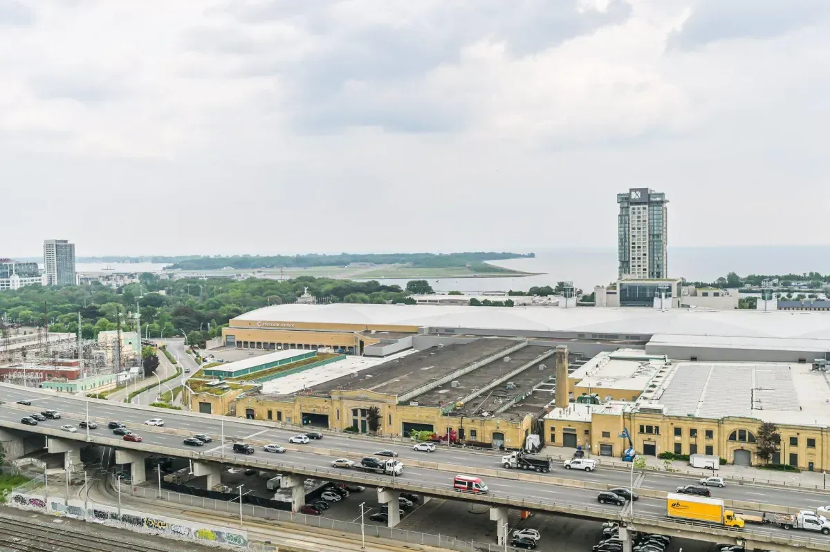 Unobstructed Southeast view of Lake Ontario, BMO Field, and Exhibition Place from the 19th floor.
