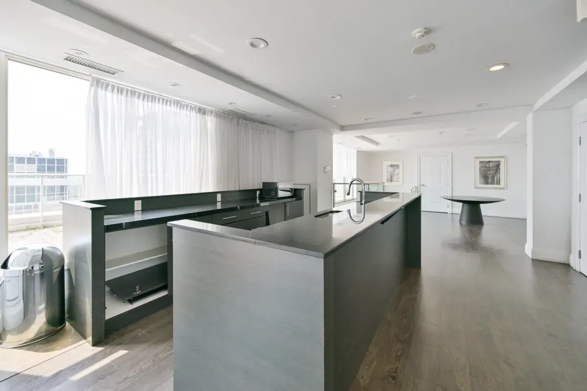 Sleek, modern catering kitchen and bar area in the Club V party room for hosting events in Liberty Village.