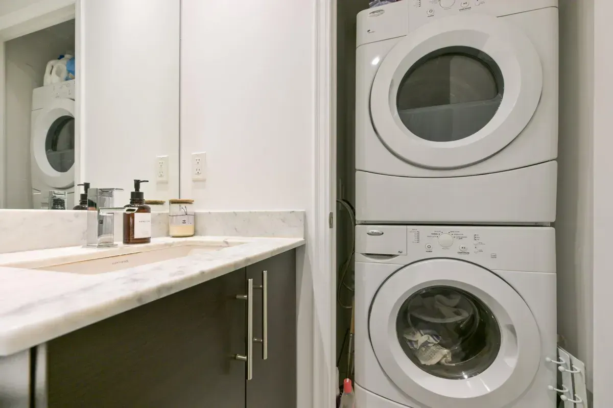 Convenient stacked washer and dryer located within unit 1909 at 85 E Liberty St.
