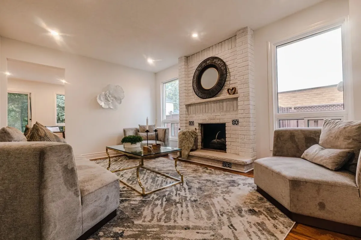 Open-concept living area at 110 Holliday Dr with a view of the fireplace and formal sitting space.