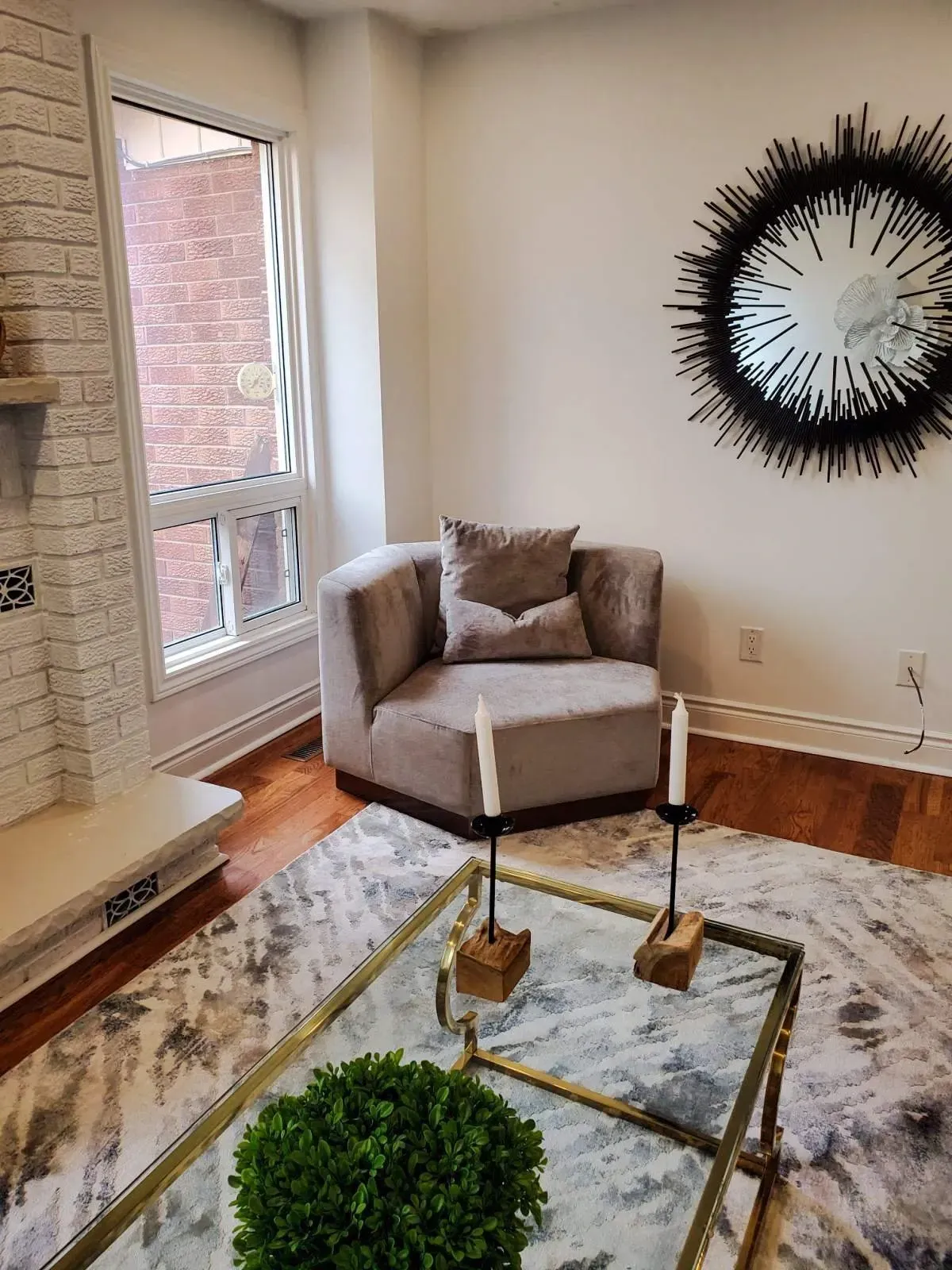 Stylish sitting area at 110 Holliday Dr with a contemporary armchair and high-end wall art.