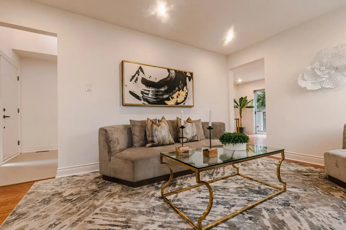 Wide-angle view of the formal living room at 110 Holliday Dr showing the flow into the dining area.