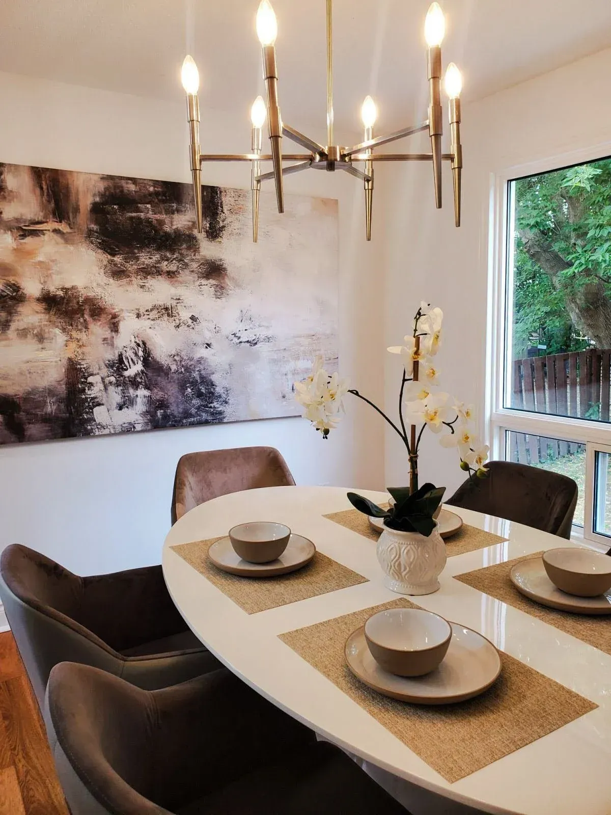 Formal dining room at 110 Holliday Dr with a modern chandelier and seating for six, perfect for family dinners.