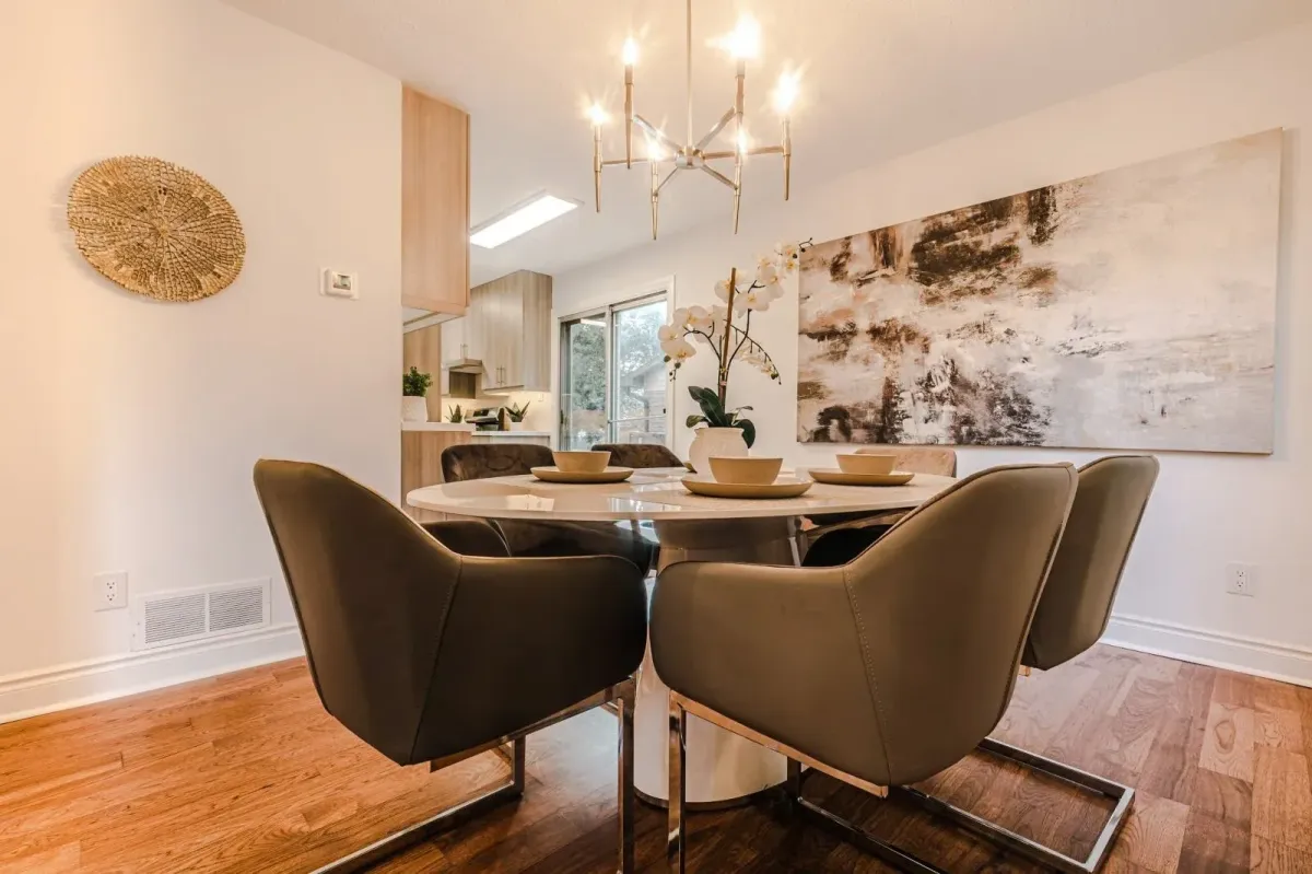 Secondary angle of the formal dining area at 110 Holliday Dr highlighting the neutral palette and hardwood floors.