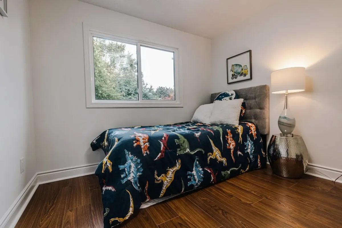 Fourth bedroom at 110 Holliday Dr styled with a child-friendly theme and large windows.