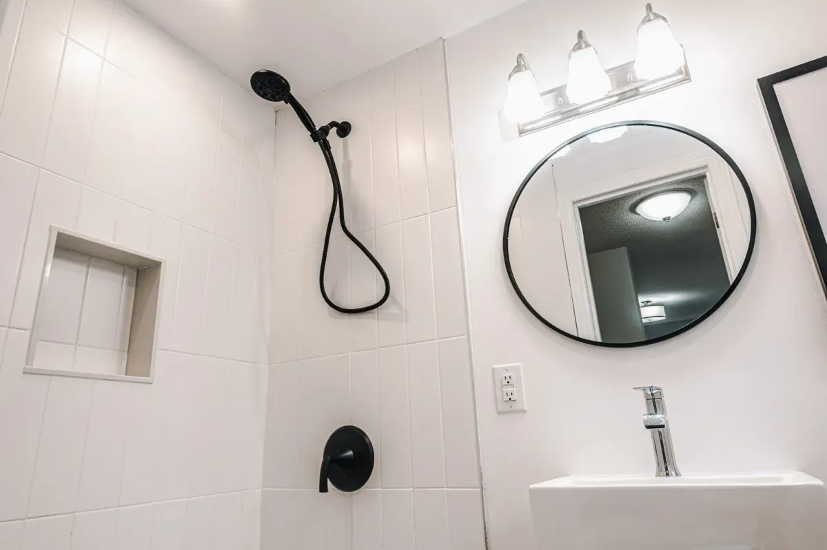 Close-up of the ensuite shower at 110 Holliday Dr with matte black hardware and custom tiling.